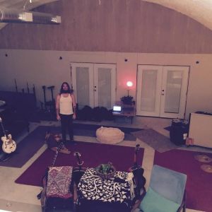 Israel standing happily in his dry studio